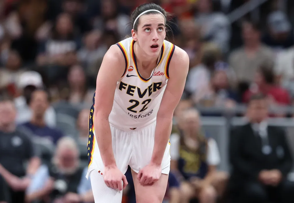 Caitlin Clark, who exited early with a back injury, looks on during the Fever's 111-109 loss to the Mercury on June 24, 2026 in Indianapolis.