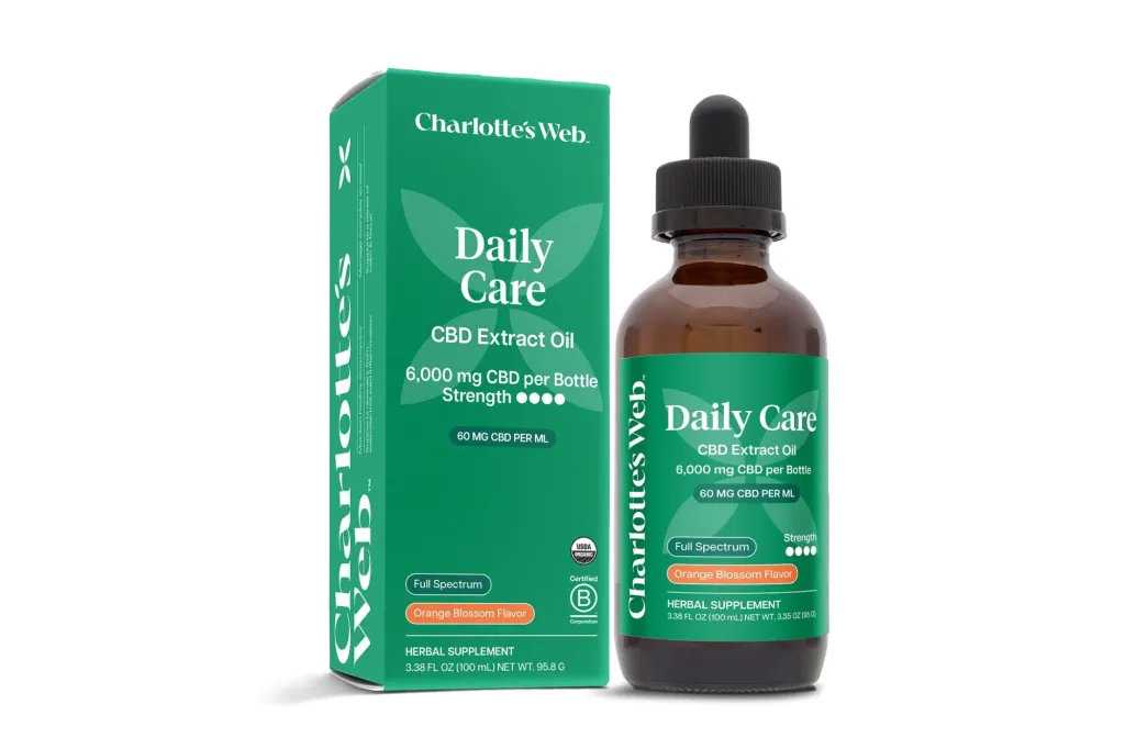A bottle of CBD oil in front of its packaging.