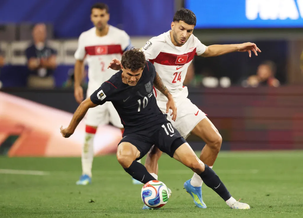Christian Pulisic looks to make a move on Oguz Aydin during the USMNT's 3-2 loss to Turkey on June 25, 2026 in Inglewood, Calif.