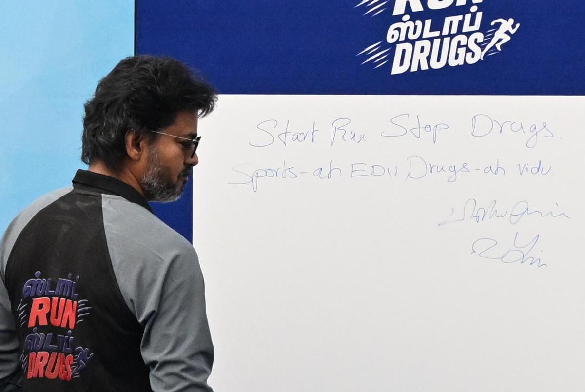 Tamil Nadu Chief Minister C. Joseph Vijay after signing ‘Sports-ah edu, drugs-ah vidu’ on a board during an event held to mark International Day Against Drug Abuse and Illicit Trafficking in Chennai on June 26, 2026