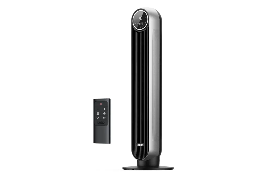 A tower fan with a remote beside it.