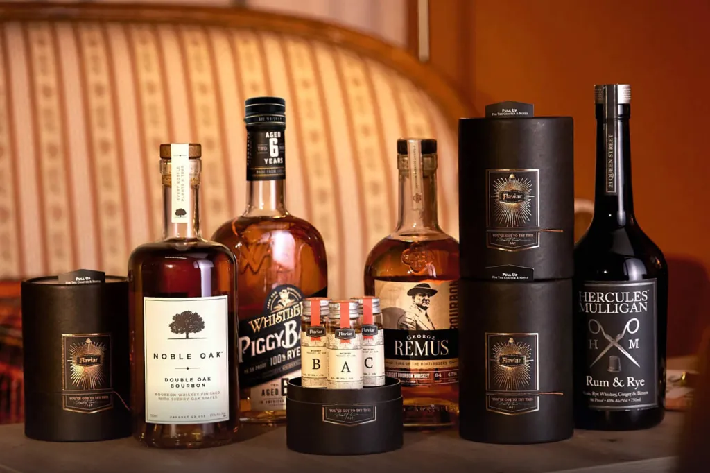 A group of alcohol bottles with George Remus' picture