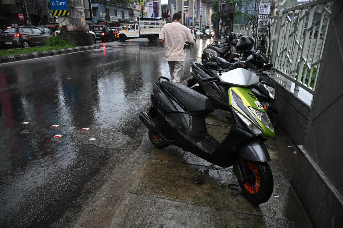 Two wheelers parked on the footpath at S A Road on June 28.