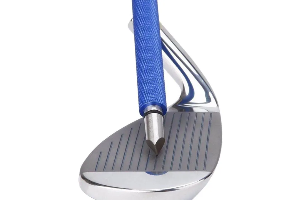 A blue golf club groove sharpener tool being used on a golf club.