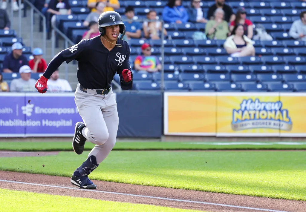 George Lombard Jr., running the bases during a Triple-A game earlier this season, "sprained a couple fingers" after jamming his left hand into a base stealer while covering second base during Tuesday's game.