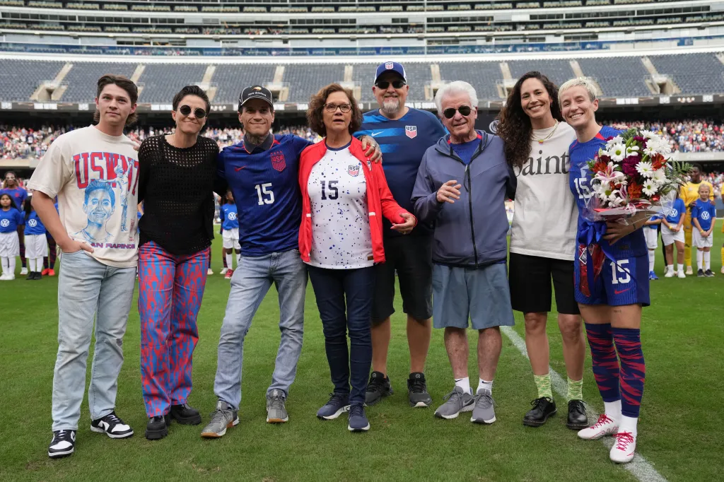 Megan Rapinoe #15 of the United States poses for a photo with her family and partner Sue Bird as she is honored prior to playing South Africa at Soldier Field on September 24, 2023 in Chicago, Illinois.