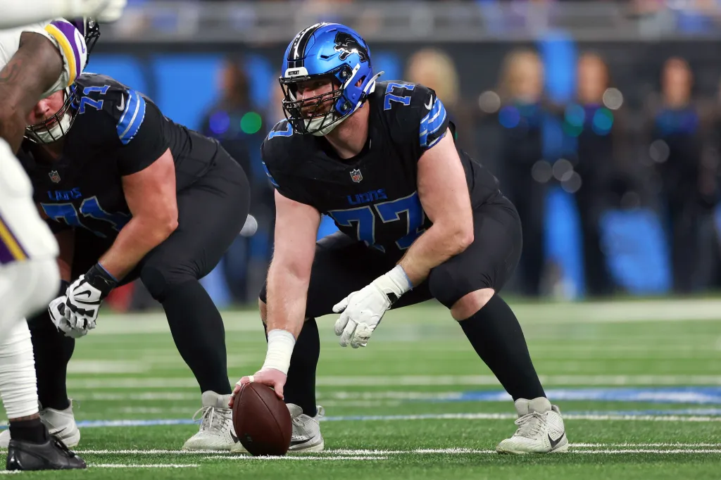 Center Frank Ragnow (77) of the Detroit Lions prepares to snap the ball during a game between the Detroit Lions and the Minnesota Vikings in Detroit, Michigan USA, on Sunday, January 5, 2025.
