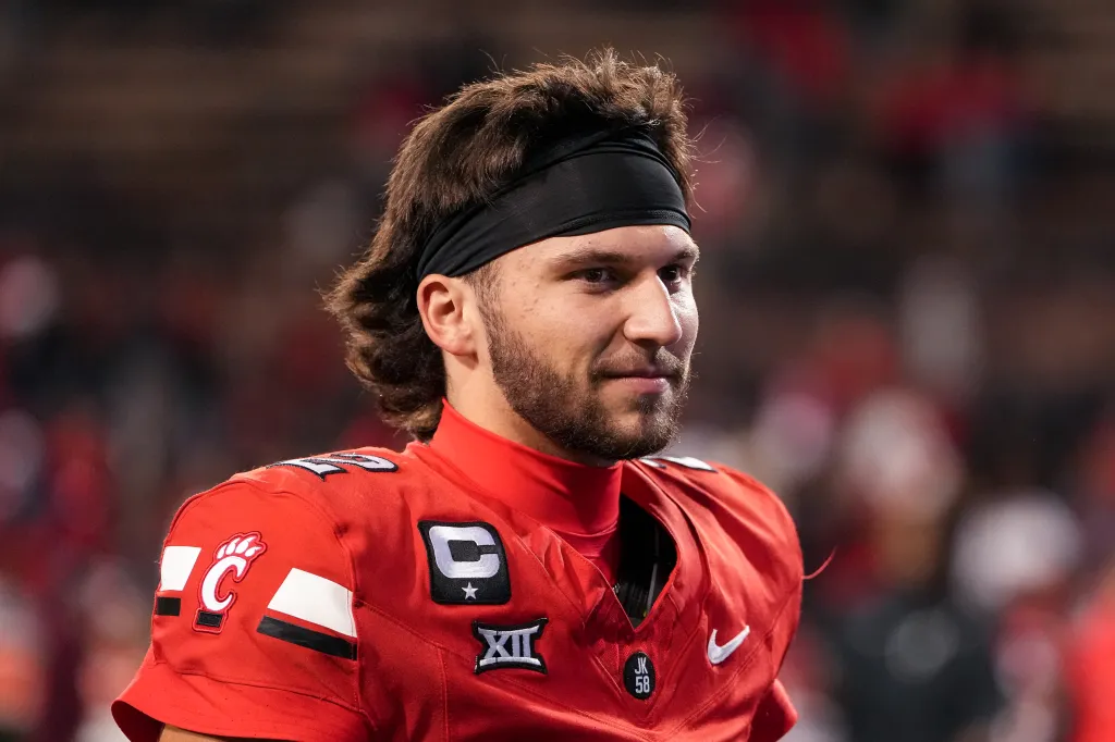 Cincinnati Bearcats quarterback Emory Jones in a red jersey.