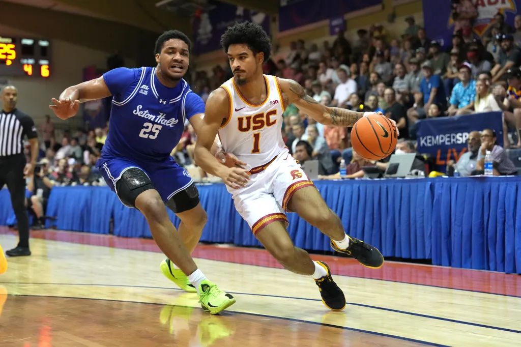 Rodney Rice (USC) dribbling the basketball while being guarded by a Seton Hall player.