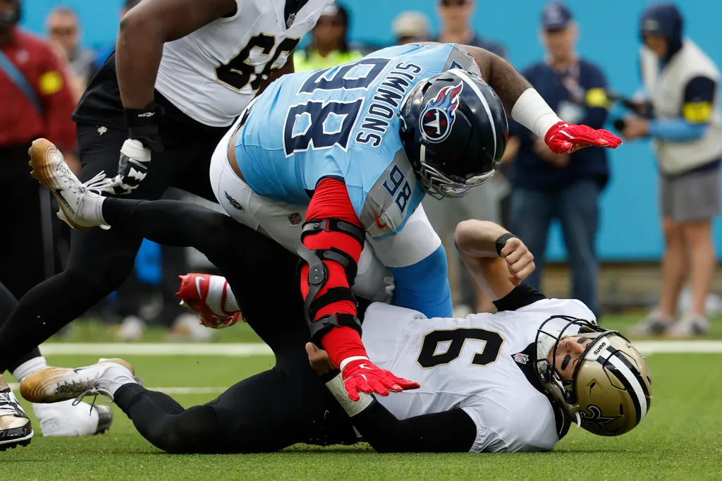 Tennessee Titans defensive tackle Jeffery Simmons (98) sacks New Orleans Saints quarterback Tyler Shough (6) during a game between the Tennessee Titans and New Orleans Saints, December 28, 2025, at Nissan Stadium in Nashville, Tennessee.