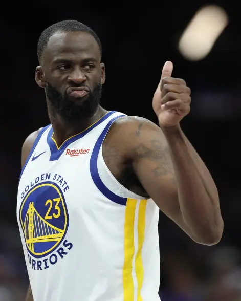 Draymond Green in his Golden State Warriors jersey giving a thumbs up.