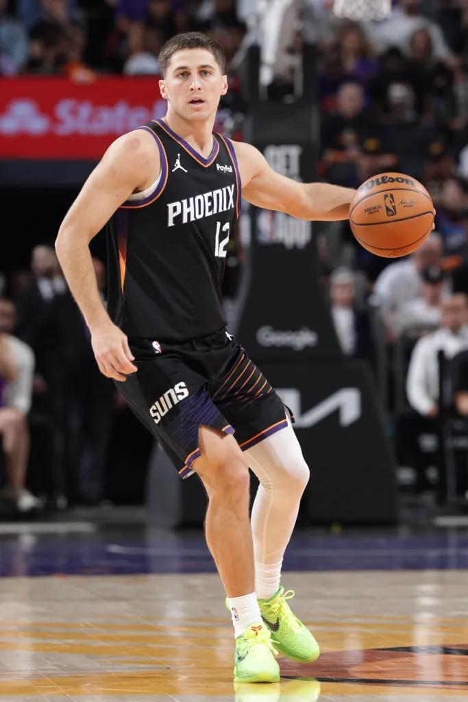 Phoenix Suns player Jock Landale dribbling a basketball during the Oklahoma City Thunder game.