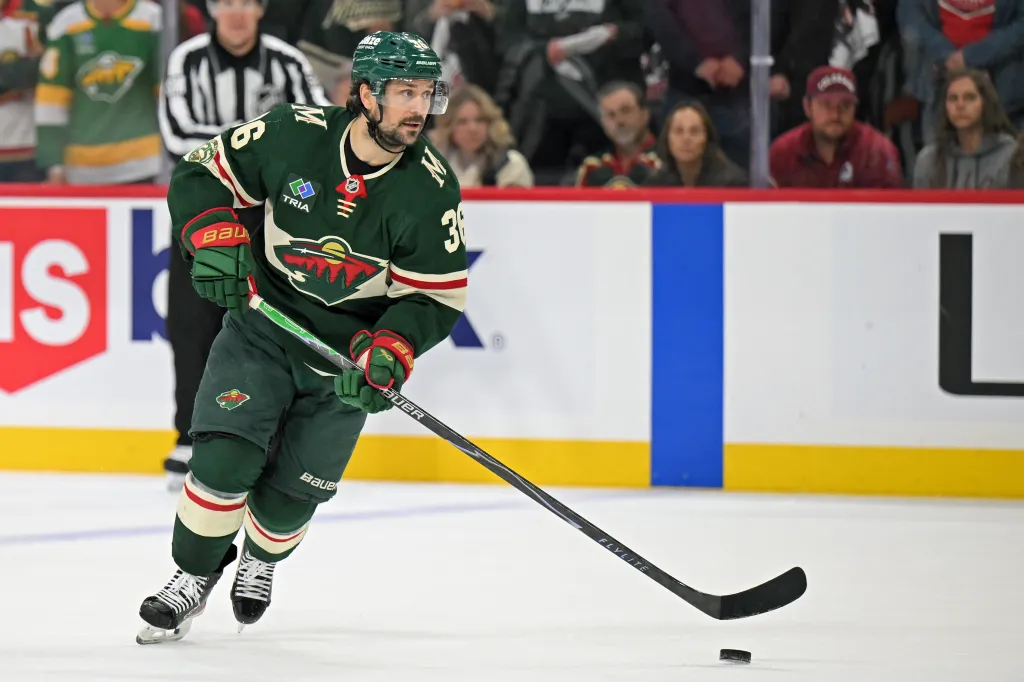 Minnesota Wild forward Mats Zuccarello (36) controls the puck against the Avalanche.