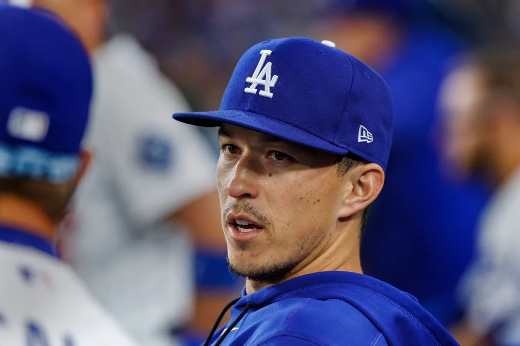 A man in a blue Dodgers baseball cap.