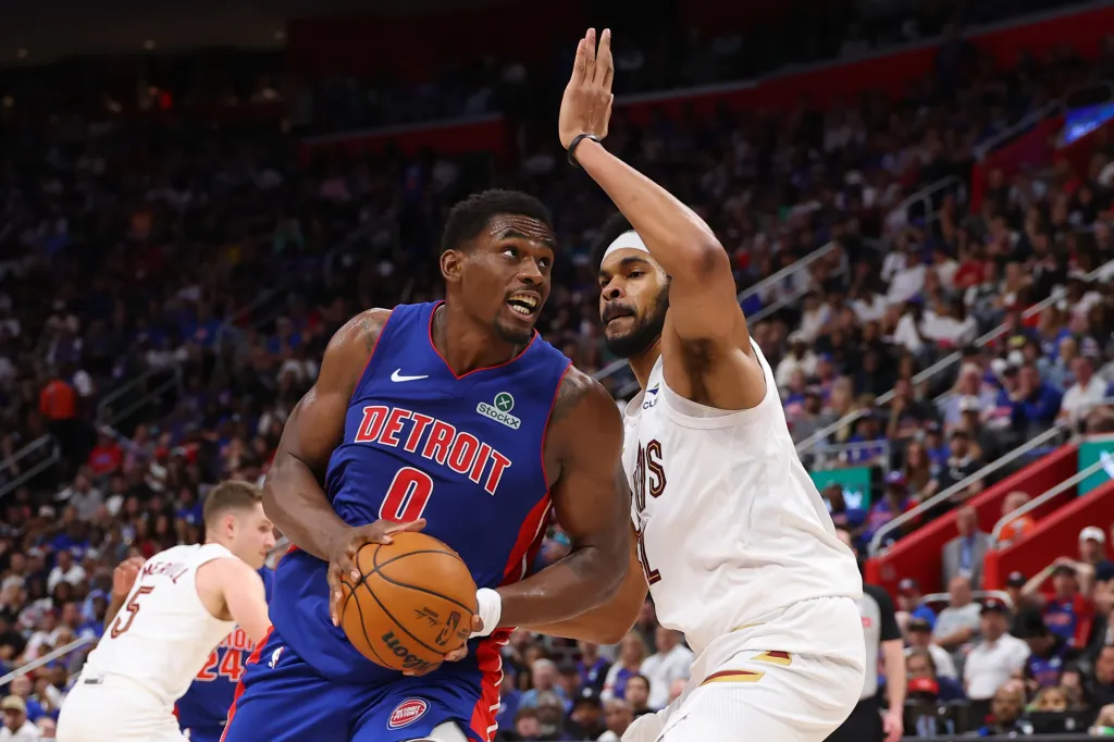 Marvin Bagley III of the Detroit Pistons drives with the ball against Jarrett Allen of the Cleveland Cavaliers.
