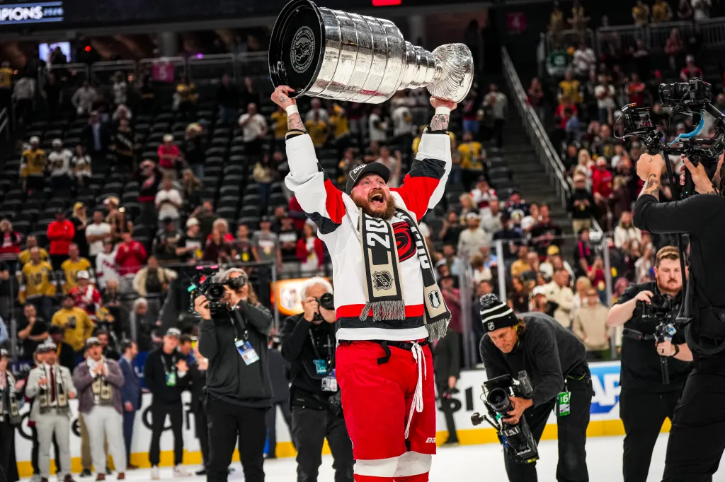 Nicolas Deslauriers #44 of the Carolina Hurricanes raises the Stanley Cup at T-Mobile Arena after defeating the Vegas Golden Knights in Game Six of the 2026 Stanley Cup Finals at T-Mobile Arena on June 14, 2026 in Las Vegas, Nevada.