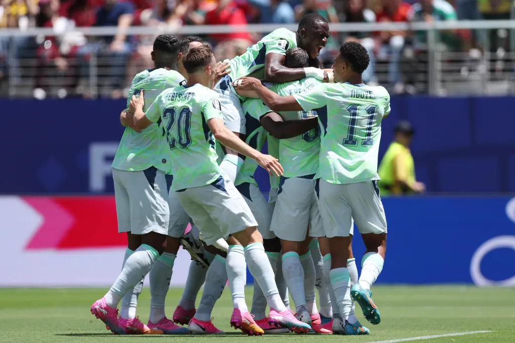 Breel Embolo #7 of Switzerland celebrates with teammates after scoring a penalty for the team's first goal during the FIFA World Cup 2026 Group B match between Qatar and Switzerland at San Francisco Bay Area Stadium on June 13, 2026 in Santa Clara, California.