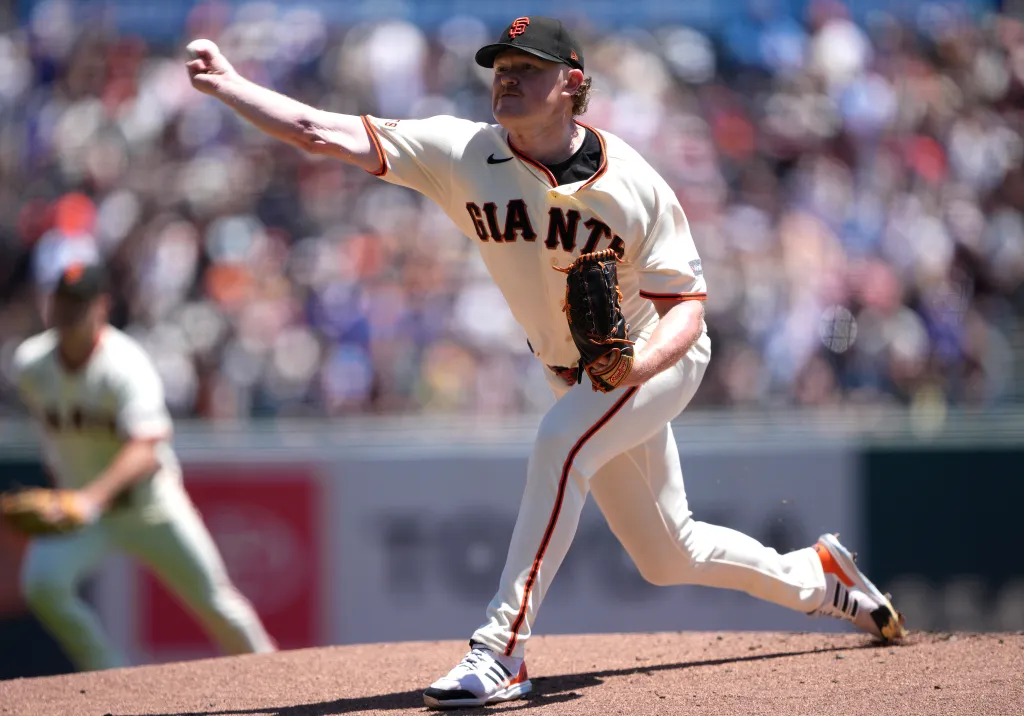 A San Francisco Giants pitcher throws a baseball from the mound.