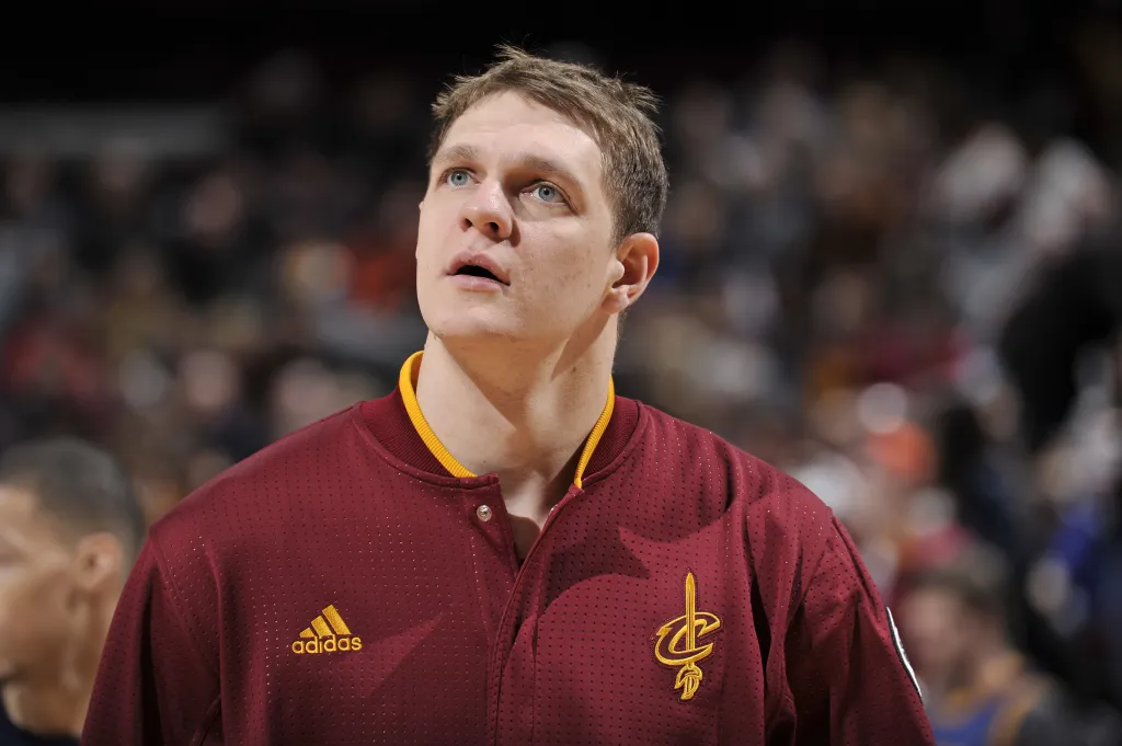 Timofey Mozgov wearing a Cleveland Cavaliers warmup jacket.