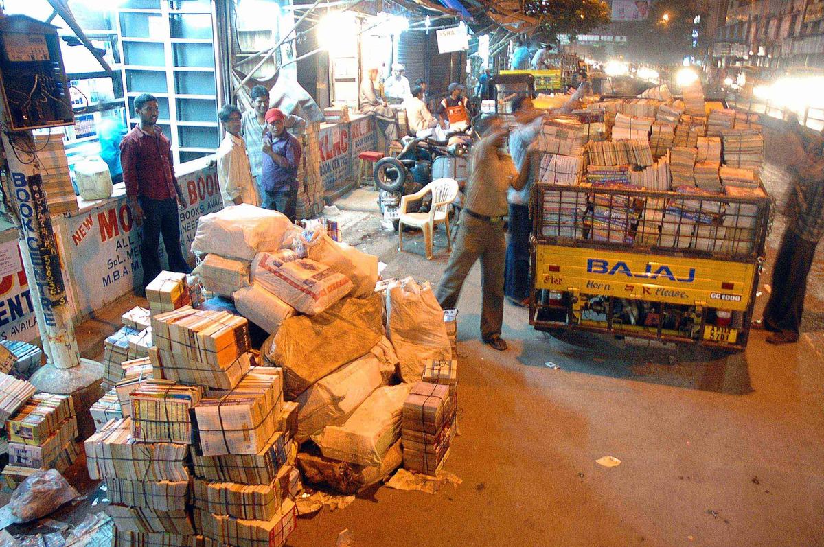 Vendors of second hand books shifting their goods following orders to vacate the pavements at Koti in Hyderabad on November 05, 2006 mid-night.