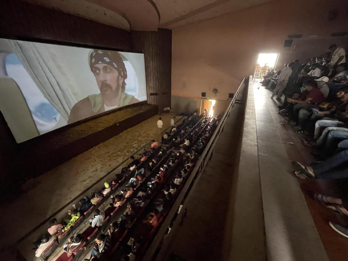 Kichcha Sudeep's fans watching the release of ‘Kotigobba-3’ in Bengaluru.