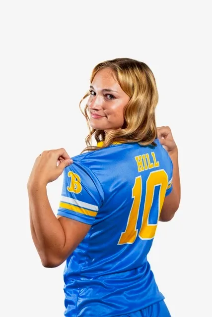 Tenley Hill in a blue jersey with "HILL" and "10" on the back.