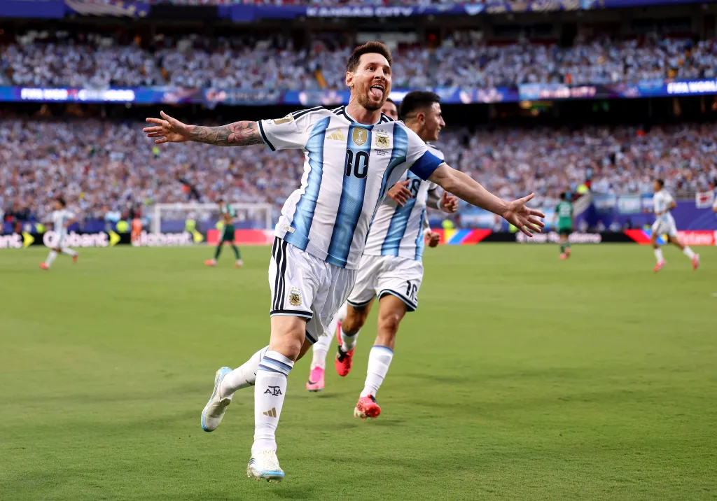 Lionel Messi celebrates after scoring the first of his three goals in Argentina's 3-0 World Cup win over Argentina.