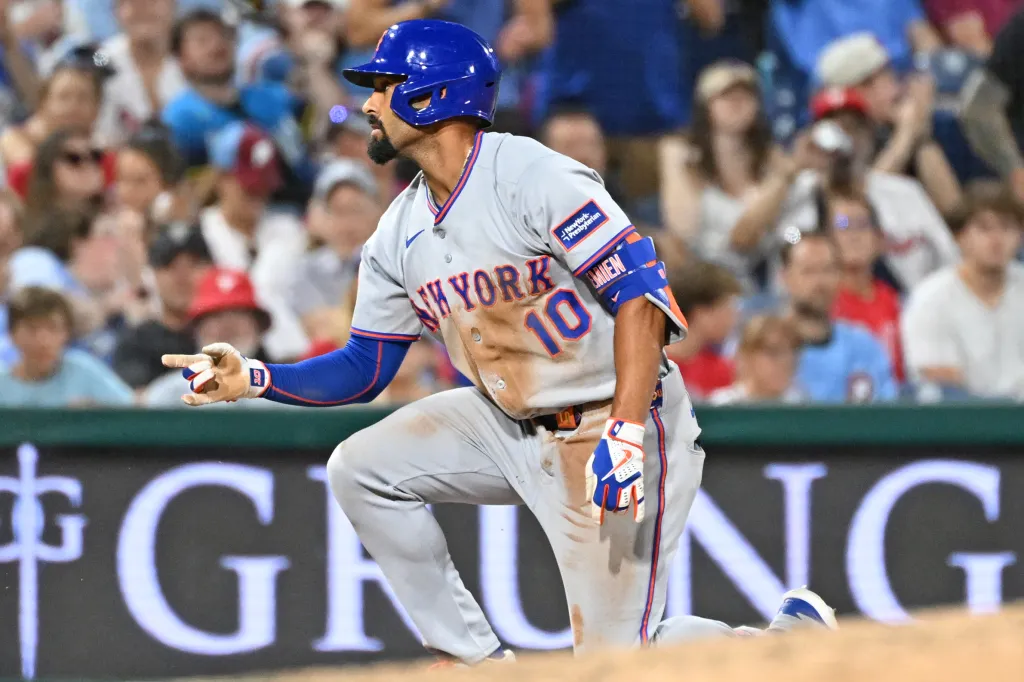 New York Mets second baseman Marcus Semien (10) reacts after hitting a two-run triple