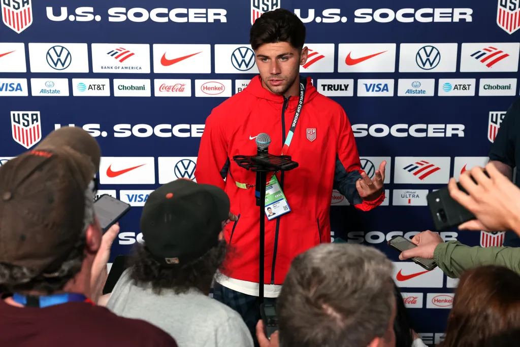 Max Arfsten talks to the media before a training session on June 23, 2026.