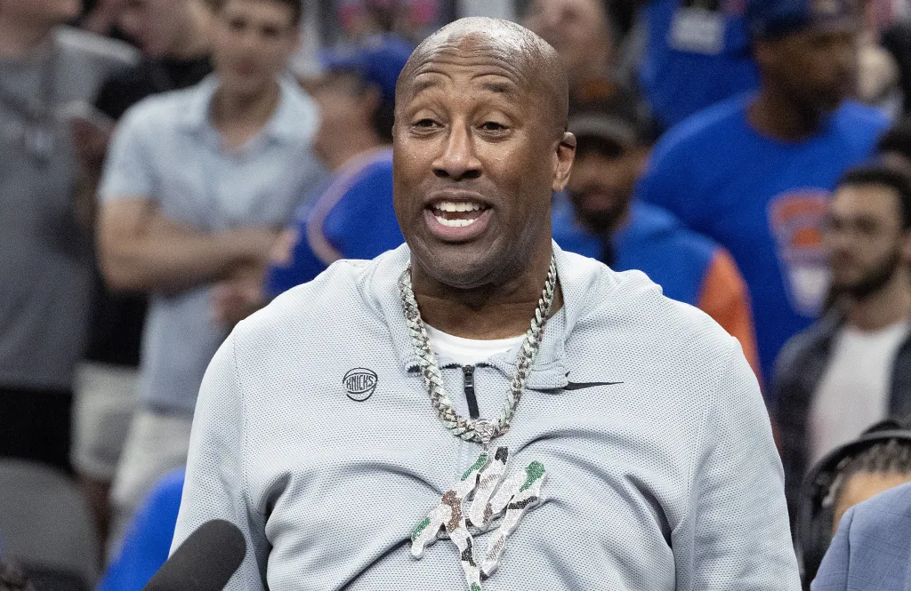 Head coach Mike Brown wears rapper Fat Joes’ chain as he addresses the crowd after the Knicks' 94-90 NBA title-clinching Game 5 win over the Spurs on July 13, 2026.
