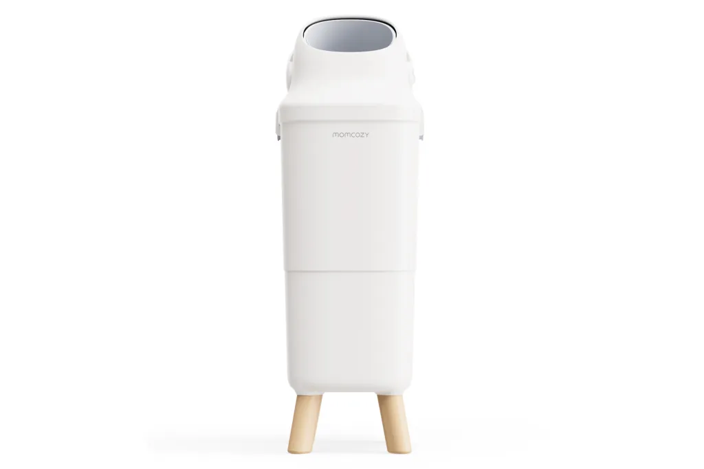 White Momcozy diaper pail with light wood legs.