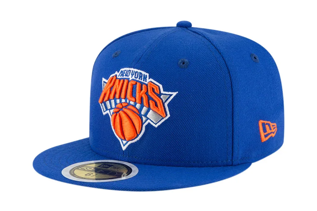 New York Knicks New Era Youth Official Team Color 59FIFTY Fitted Hat in blue with the team's logo.