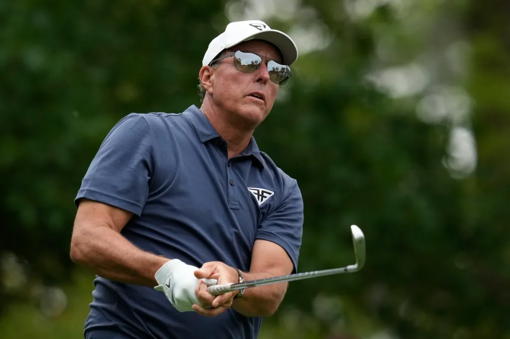 Phil Mickelson watches his tee shot during the 2023 Masters at Augusta National.