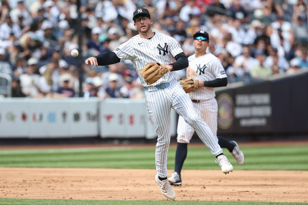 Ryan McMahon, who is now on the IL, makes a putout during a Yankees' game against the Reds this past weekend.