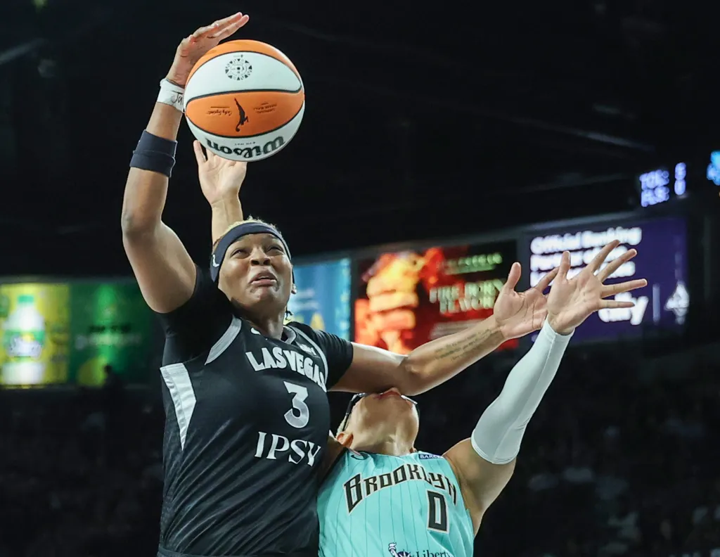 Satou Sabally (0) gets hit in the head after fouling NaLyssa Smith in the first quarter of the Liberty's win over the Aces. After briefly reentering the game in the second quarter, she was force to sit the rest of the game.
