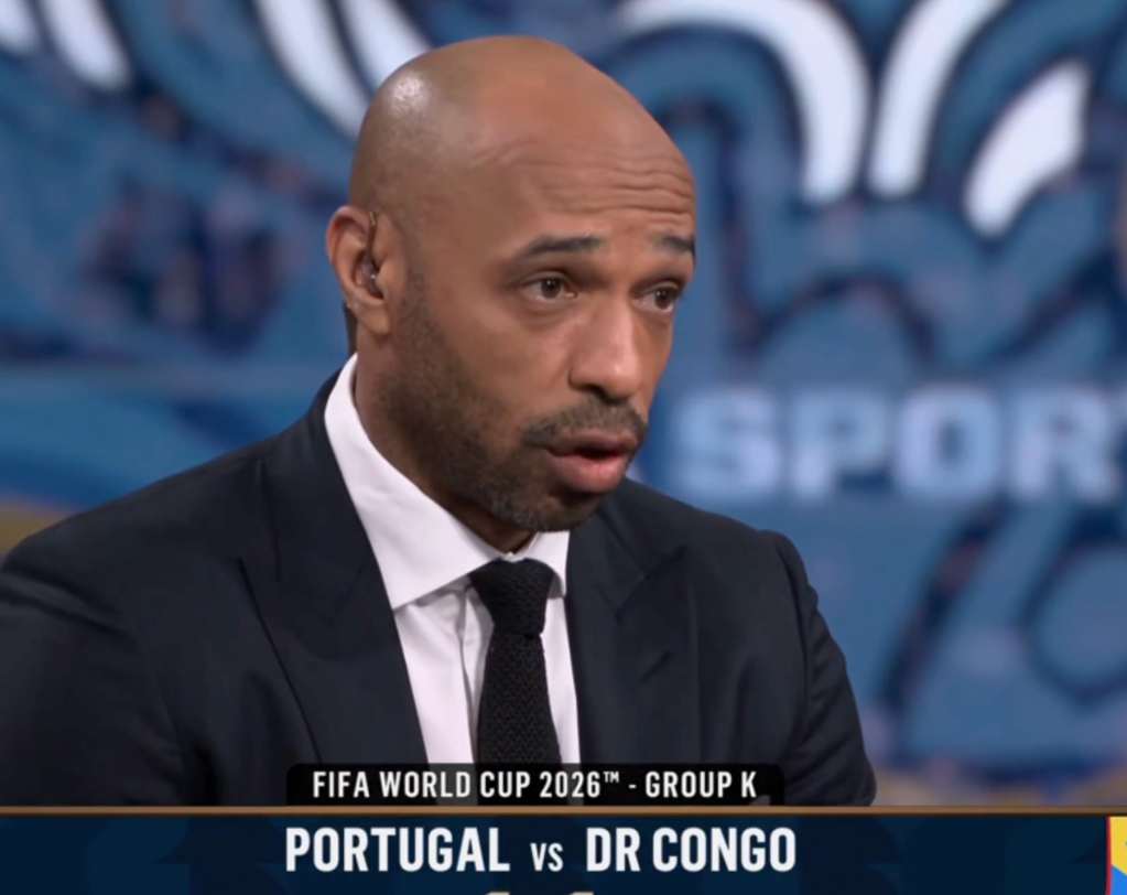 Man in a suit discussing the FIFA World Cup 2026 Group K match between Portugal and DR Congo.