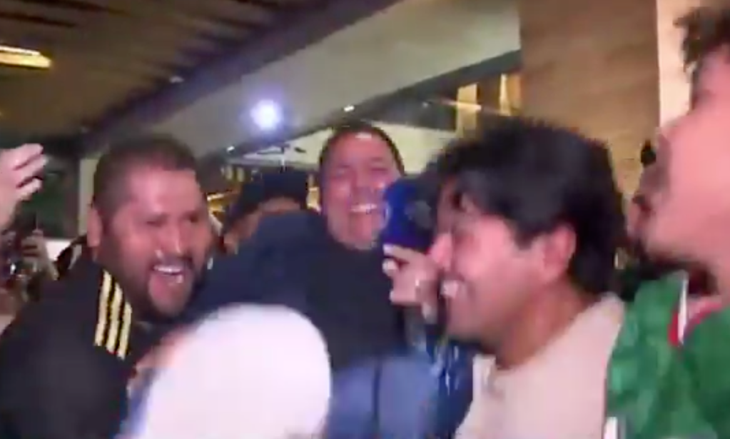 Fox Sports Mexico reporter Carlos Rodrigo Hernandez is lifted in the air by fans