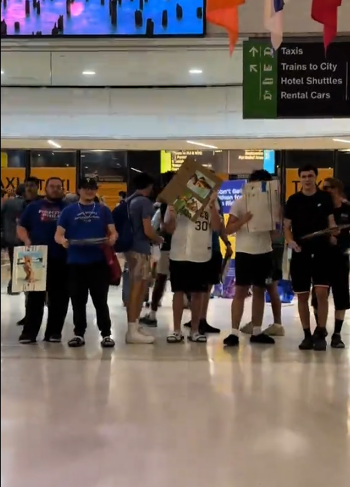 Fans wait for Livvy Dunne at the airport. 