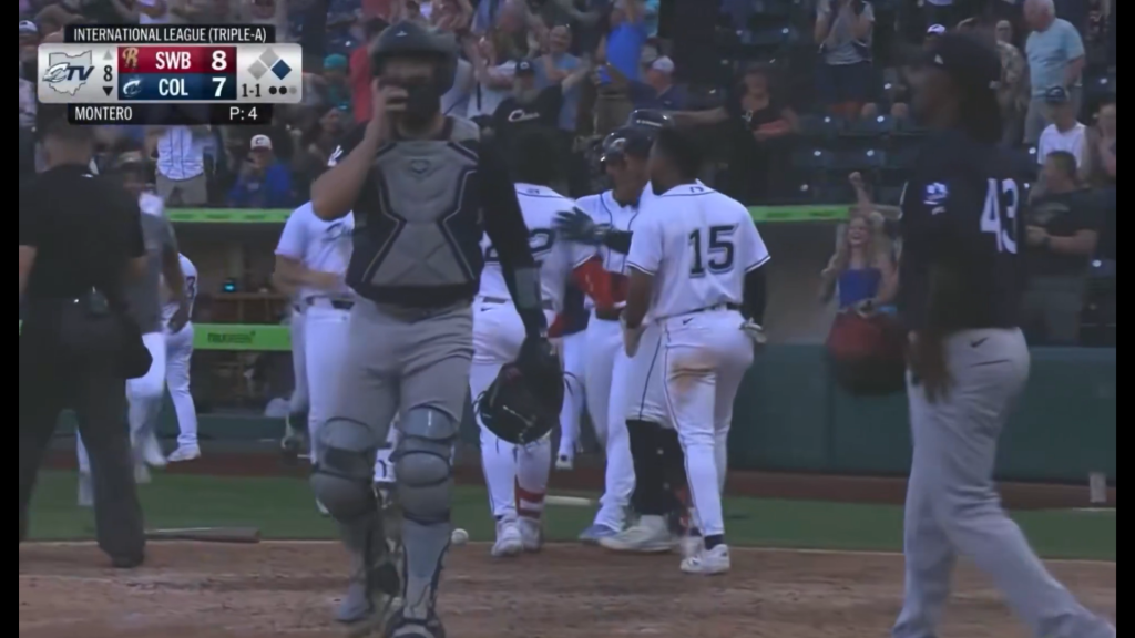 Columbus celebrating their inside the park homerun.
