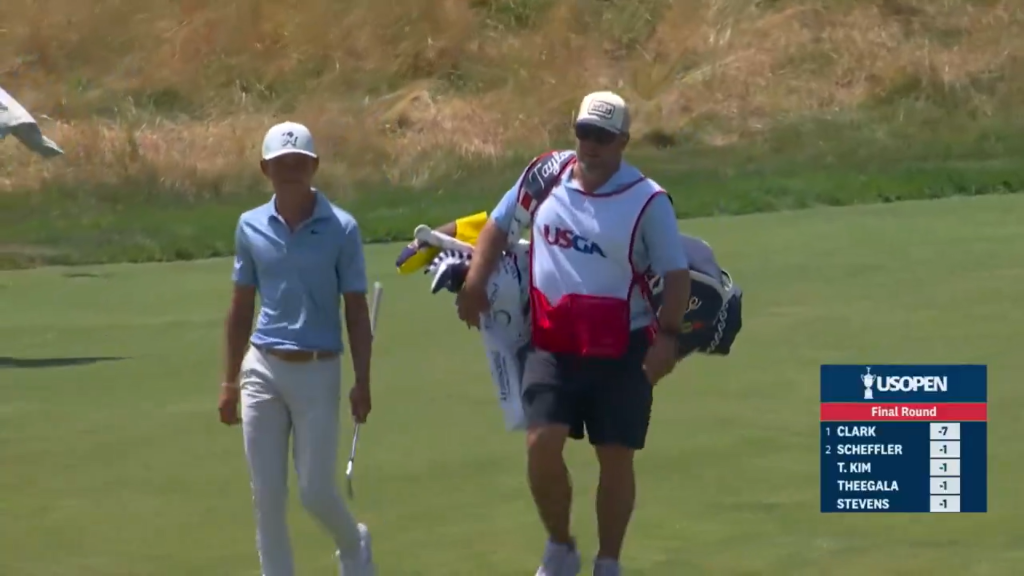 Miles Russell walking with his dad as his caddie for the 18th hole at the U.S. Open for a memorable Father's Day gift.
