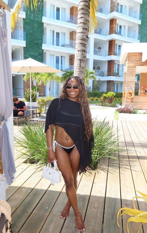 Simone Biles poses for a phote while on vacation in Belize.