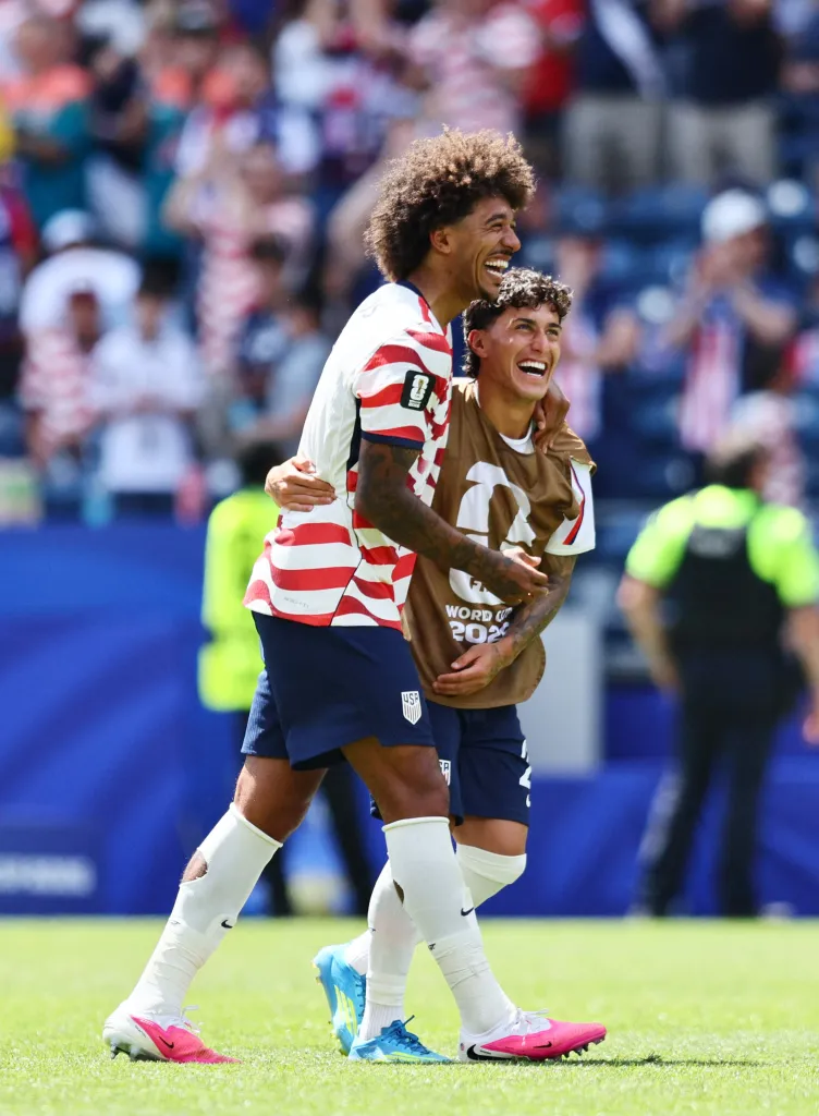 Chris Richards and Alex Zendejas of the U.S. celebrate after the match.