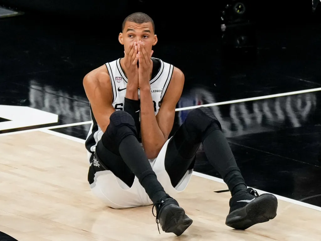 Victor Wembanyama reacts dejectly after a play during the Spurs' 94-90 NBA season-ending Game 5 loss to the Knicks on June 13, 2026 in San Antonio.