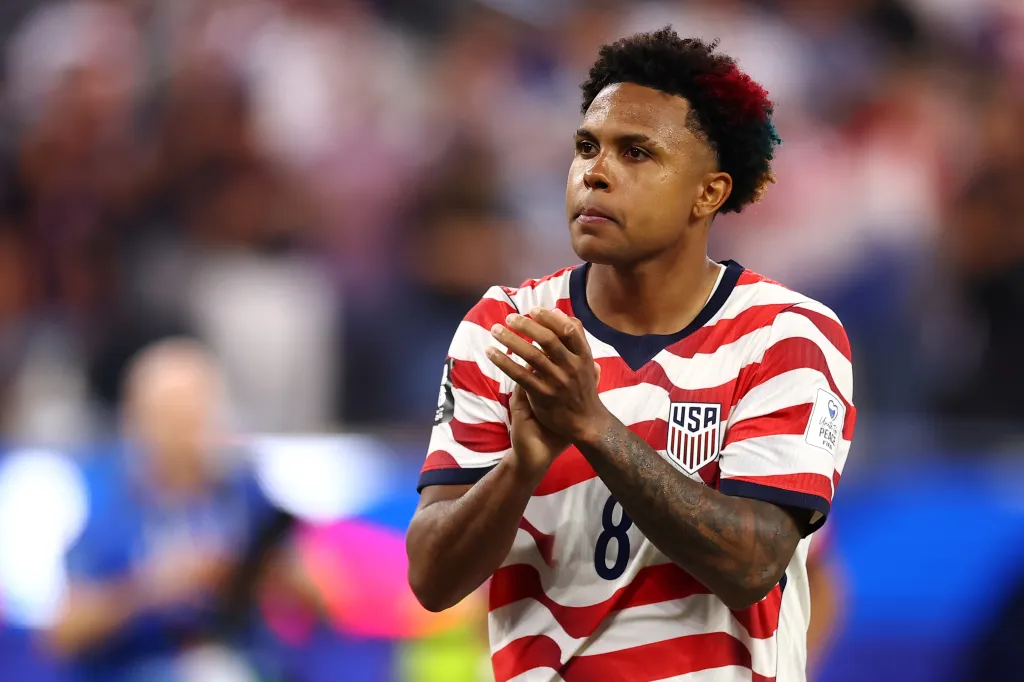 Weston McKennie applauds the fans after the USMNT's 4-1 win over Paraguay in their World Cup opener.