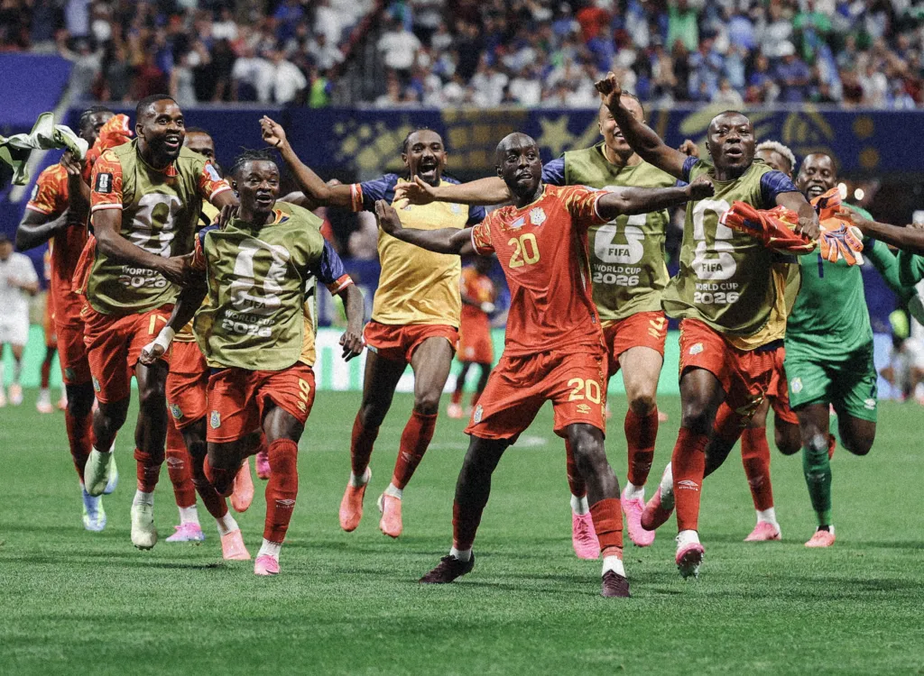 Yoane Wissa (20) and his Congo teammates celebrate after their World Cup win over Uzbekistan.
