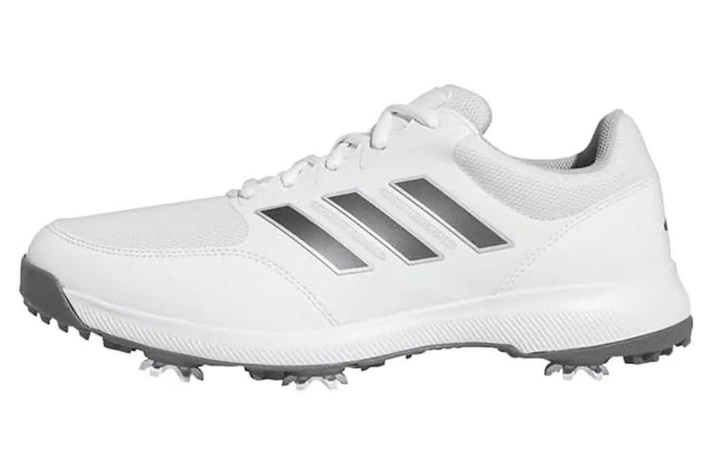White Adidas golf shoe with gray stripes.