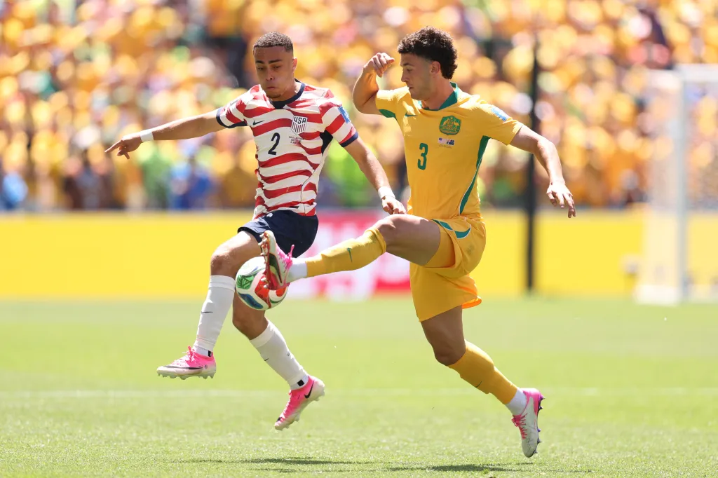 USA and Australian soccer players Alessandro Circati and Sergino Dest compete for the ball during a FIFA World Cup 2026 Group D match.