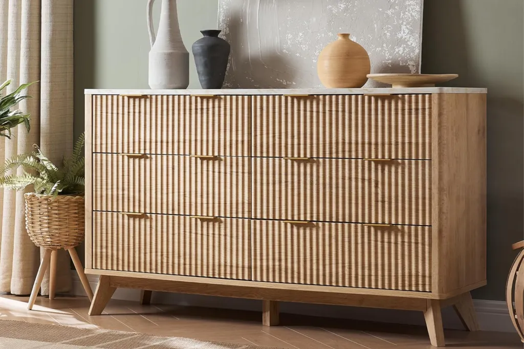 Amazon dresser with a ribbed front and marble top.