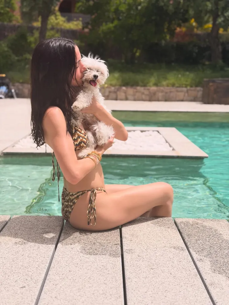Ana de Armas and her dog, Elvis, enjoy a chill day at the pool.