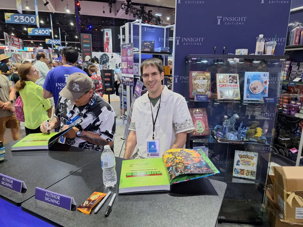 Andrew Farago, San Francisco Cartoon Museum curator, smiling at an author signing event.